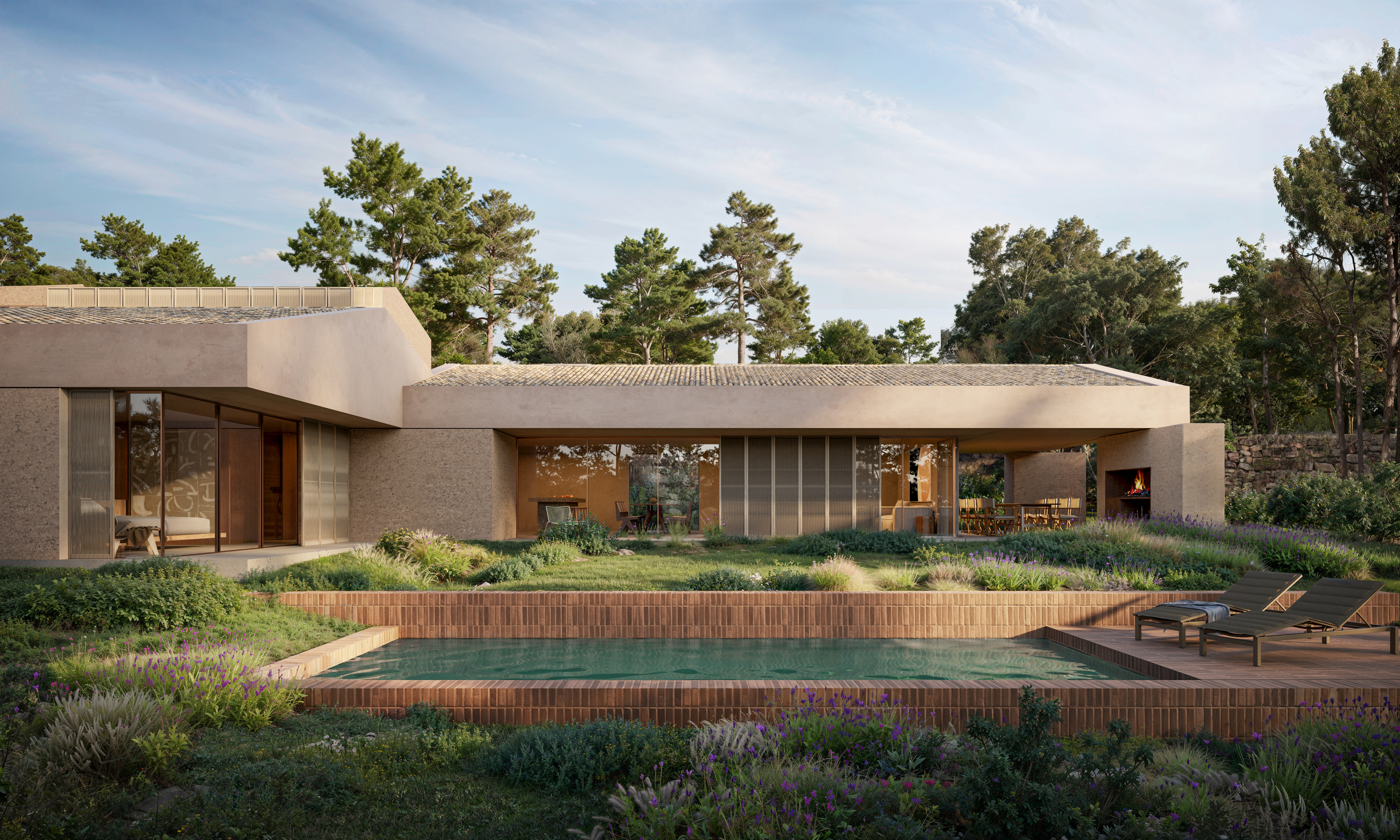 Casa contemporània de luxe amb parets de textura terragosa, grans finestrals i un porxo amb vistes a una piscina privada a la natura.