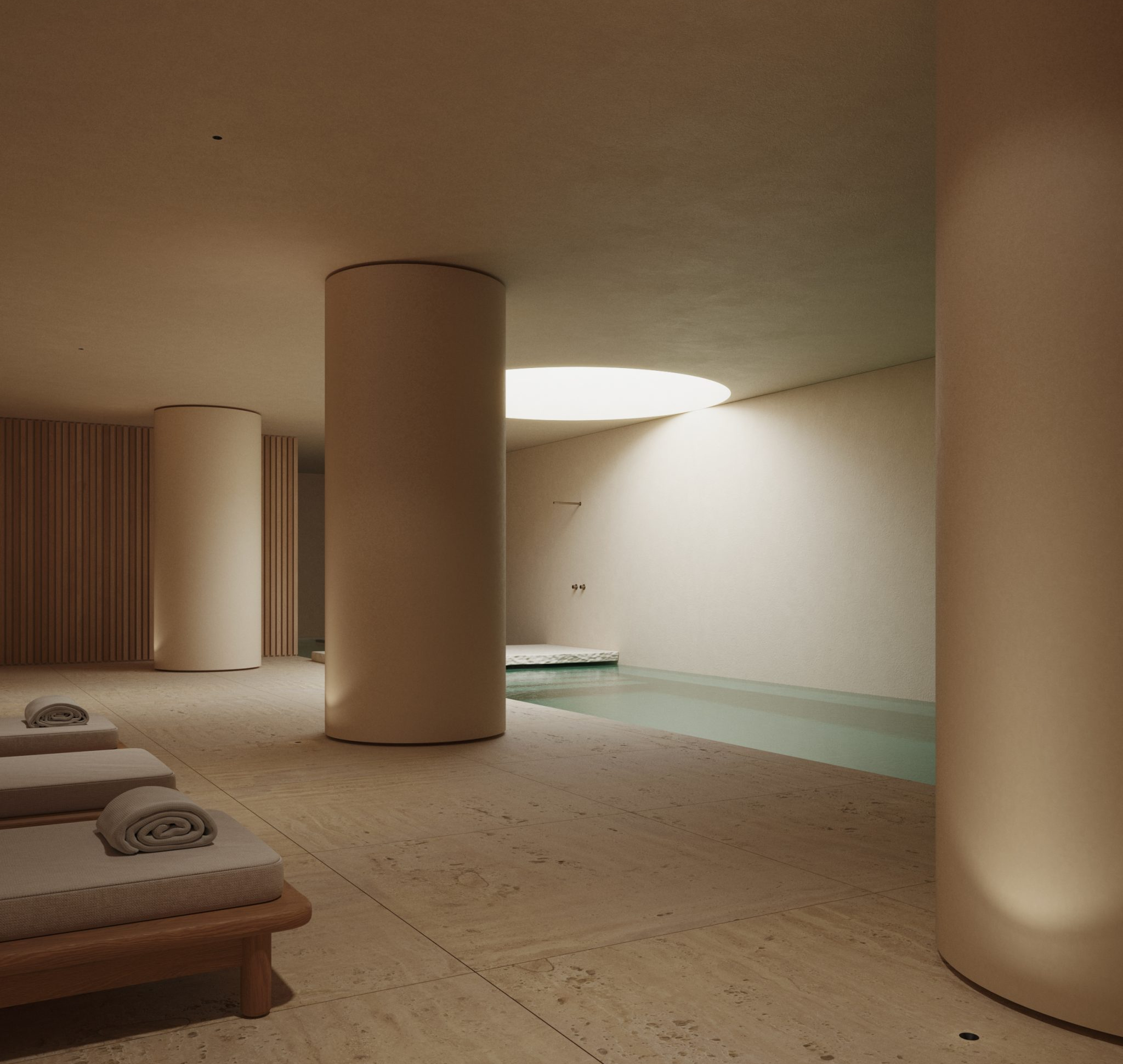 Interior d'un SPA d'hotel reformat al Maresme per a [Nom del teu Despatx]. Disseny arquitectònic minimalista amb llum zenital, tons càlids i materials naturals per a la zona d'aigües.